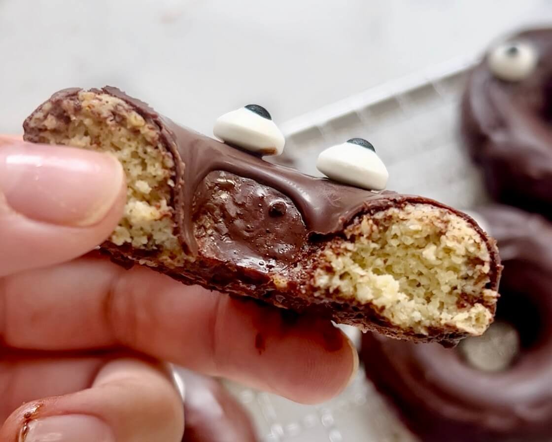 Chocolate Apple Doughnuts, one held in hand showing internal texture