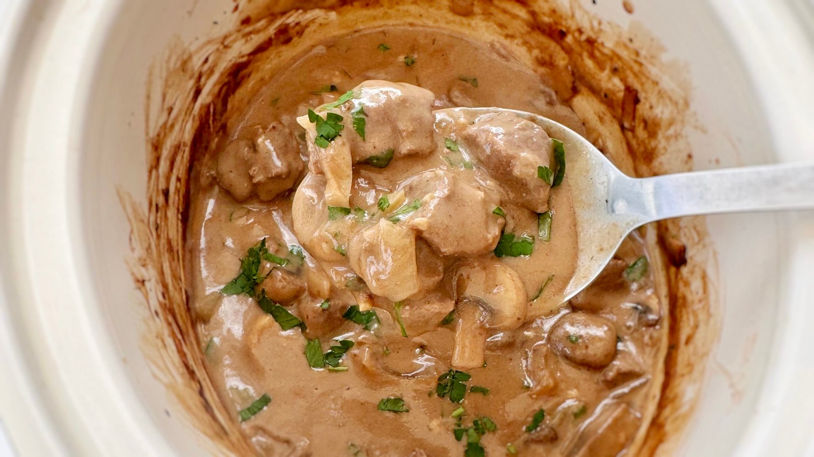 A bowl with Healthy Slow Cooker Beef Stroganoff