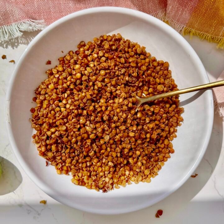 a bowl of lentils with a spoon