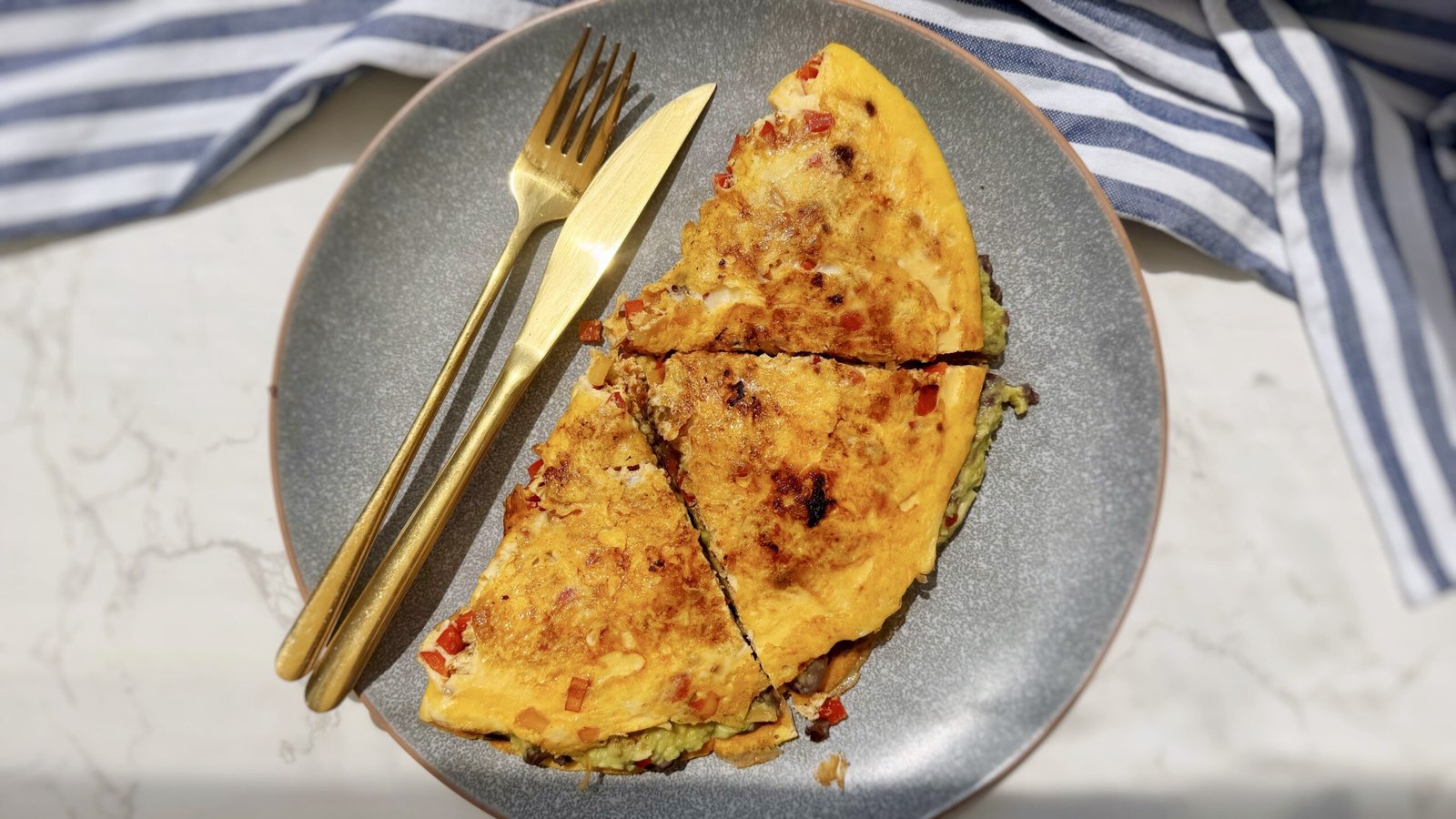 chipotle omelette, spicy omelette recipe, high-protein breakfast, eggs with black beans, avocado omelette, Mexican-inspired breakfast, quick omelette idea, healthy brunch recipe, easy egg recipes, vegetarian omelette