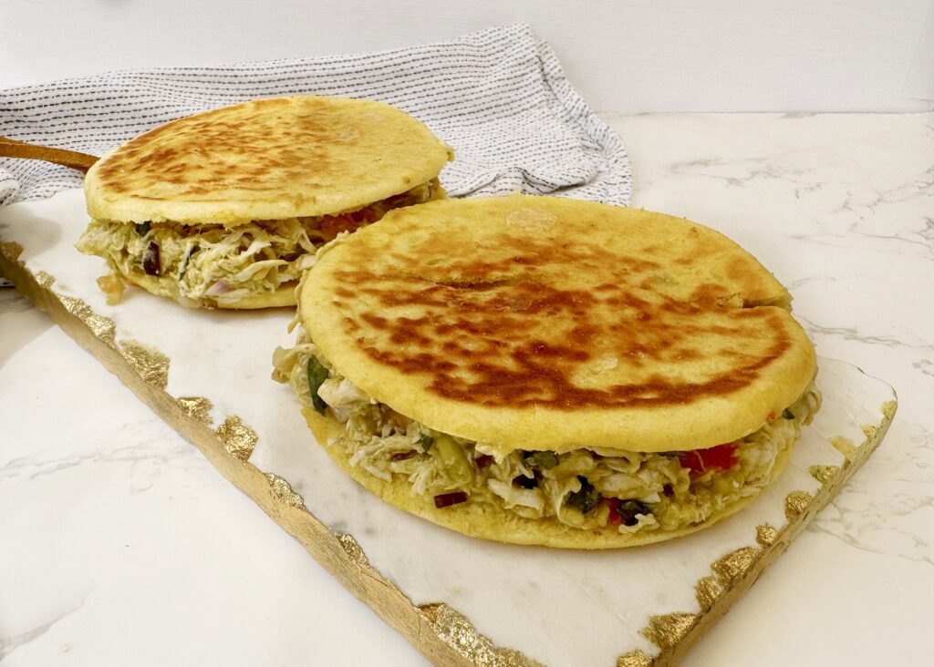 Colombian chicken bun recipe, chicken avocado bun, quick Colombian lunch, Latin American street food, crispy cheese sandwich, Colombian snack ideas, avocado chicken roll, Colombian arepa sandwich
