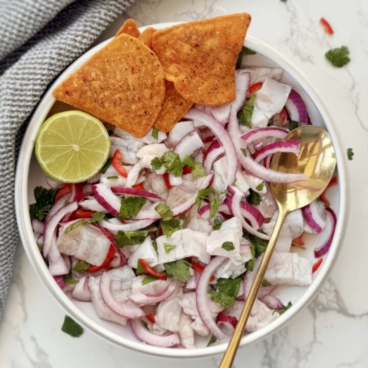 Authentic Peruvian Ceviche with lime-cured fish, red onion, chilli slices, coriander, served with sweet potato and corn