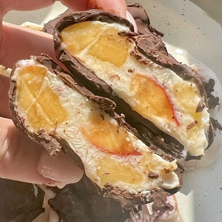 Homemade Peach Clusters with yoghurt and dark chocolate on a tray, chilled and ready to serve