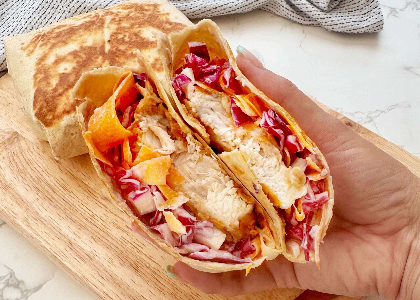 Hot honey chicken wraps cut in half
