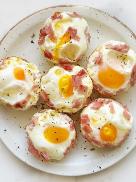 Golden Cheesy Ham Egg Bites baked in a muffin tin – a high-protein, low-carb breakfast or snack option.