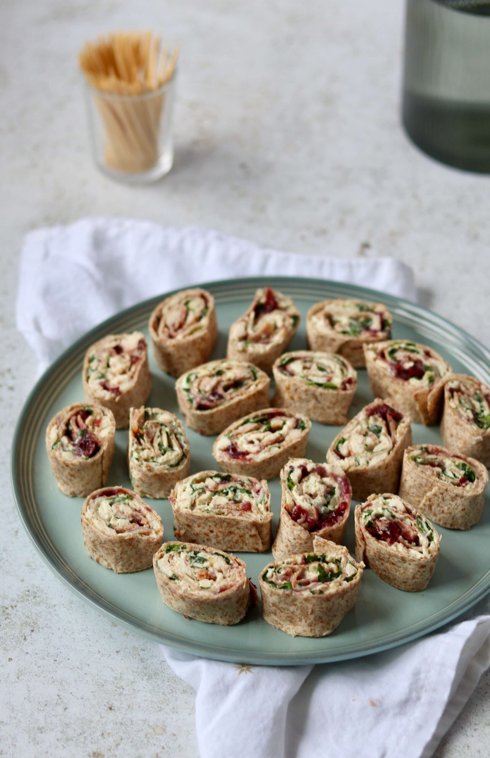 Best Turkey Cranberry Pinwheels arranged over a plate