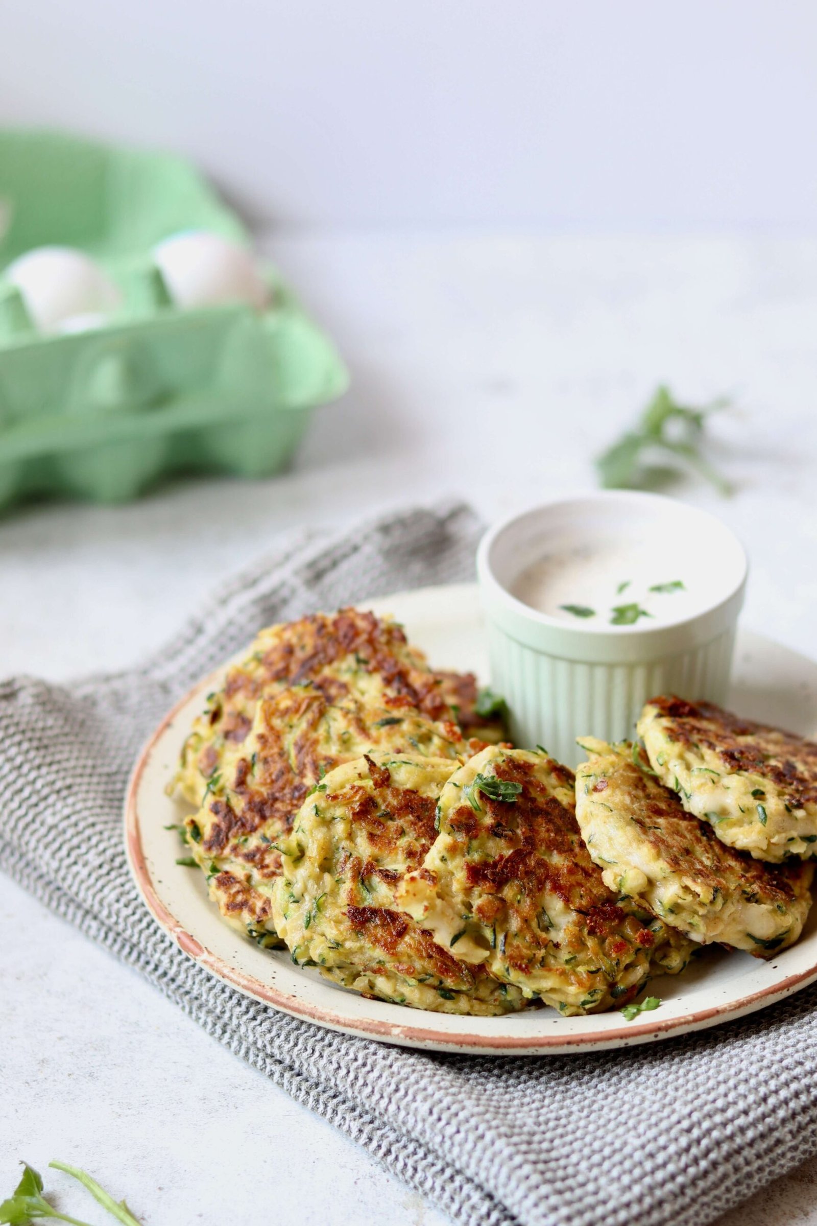 Cheesy Zucchini Fritters with Herbed Greek Yogurt Dip, view from side above