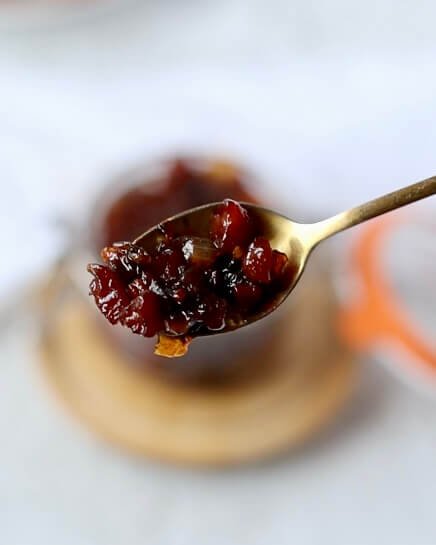 Caramelized Onion and Bacon Jam shown on a spoon