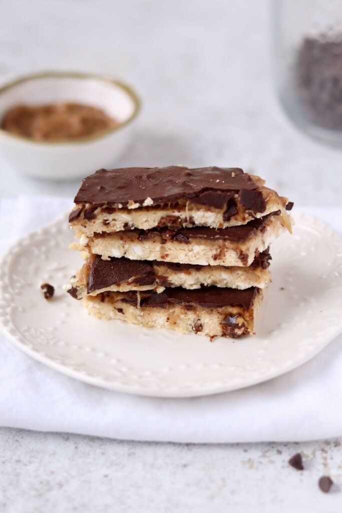 High Protein Cottage Cheese Cookie Dough Bark cut pieces stacked over a plate