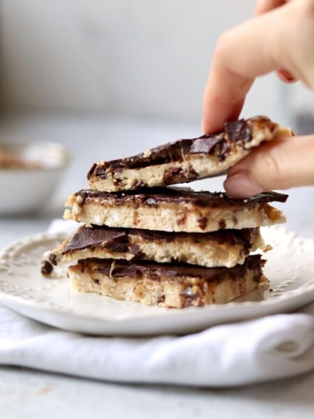 High Protein Cottage Cheese Cookie Dough Bark a hand taking a bar