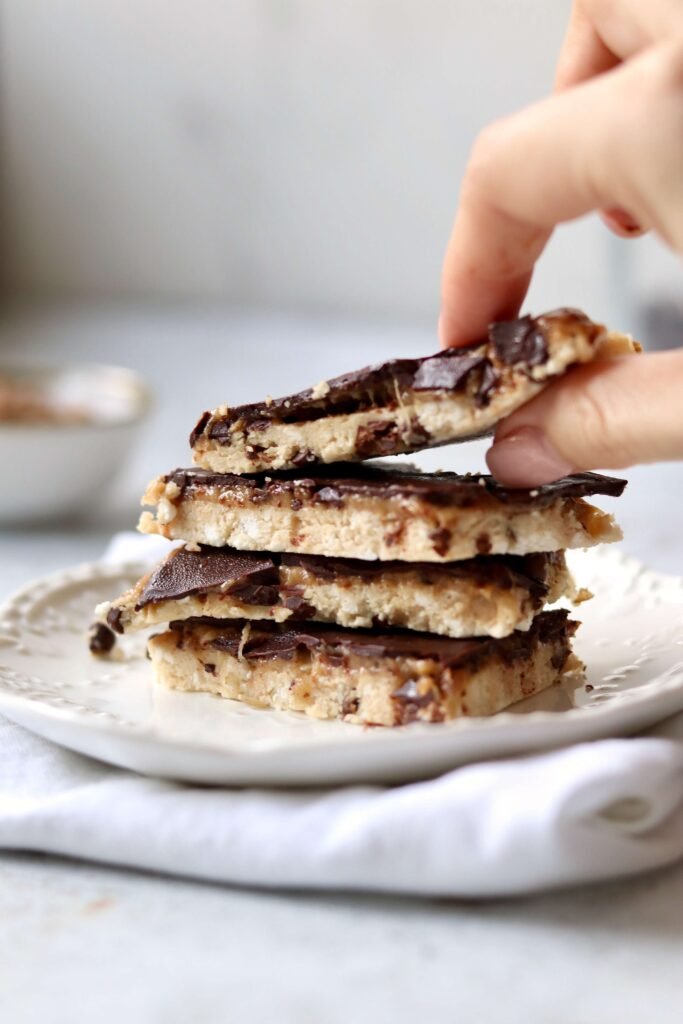High Protein Cottage Cheese Cookie Dough Bark a hand taking a bar