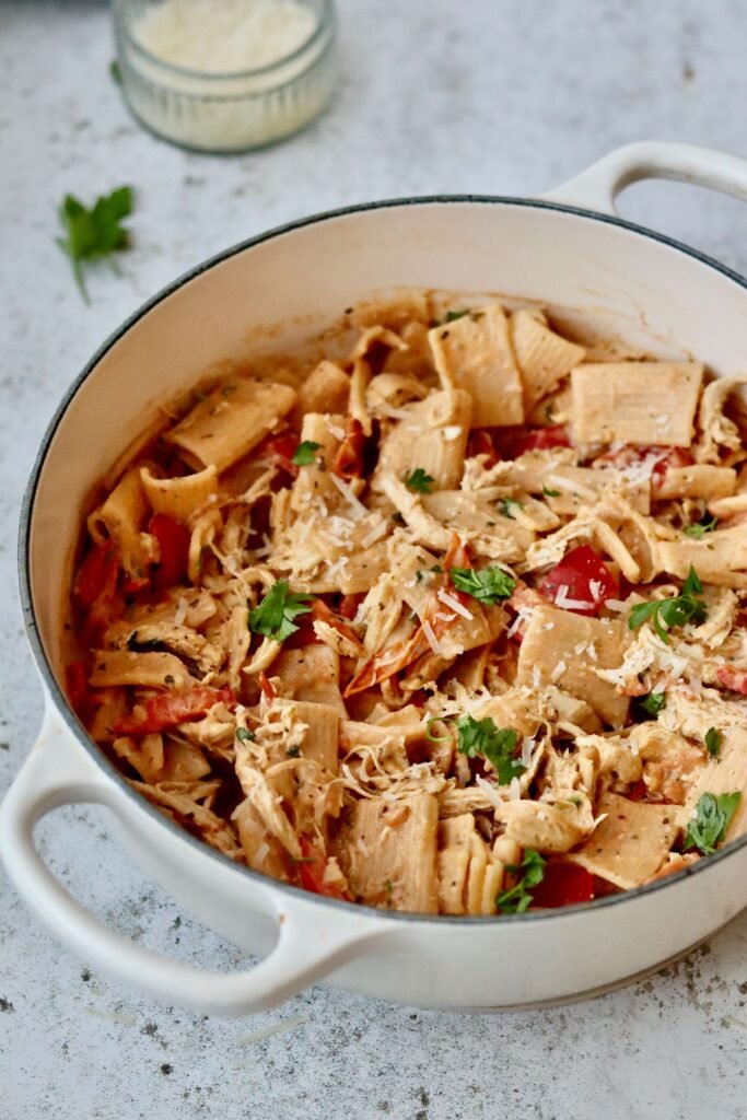 Large bowl of spicy brousin pasta topped with parmesan and parsley