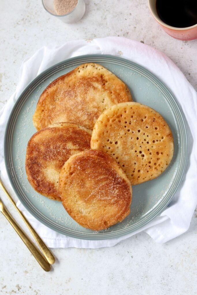 Colombian Arepuelas (Fried Pancakes) served on plate viewed from above
