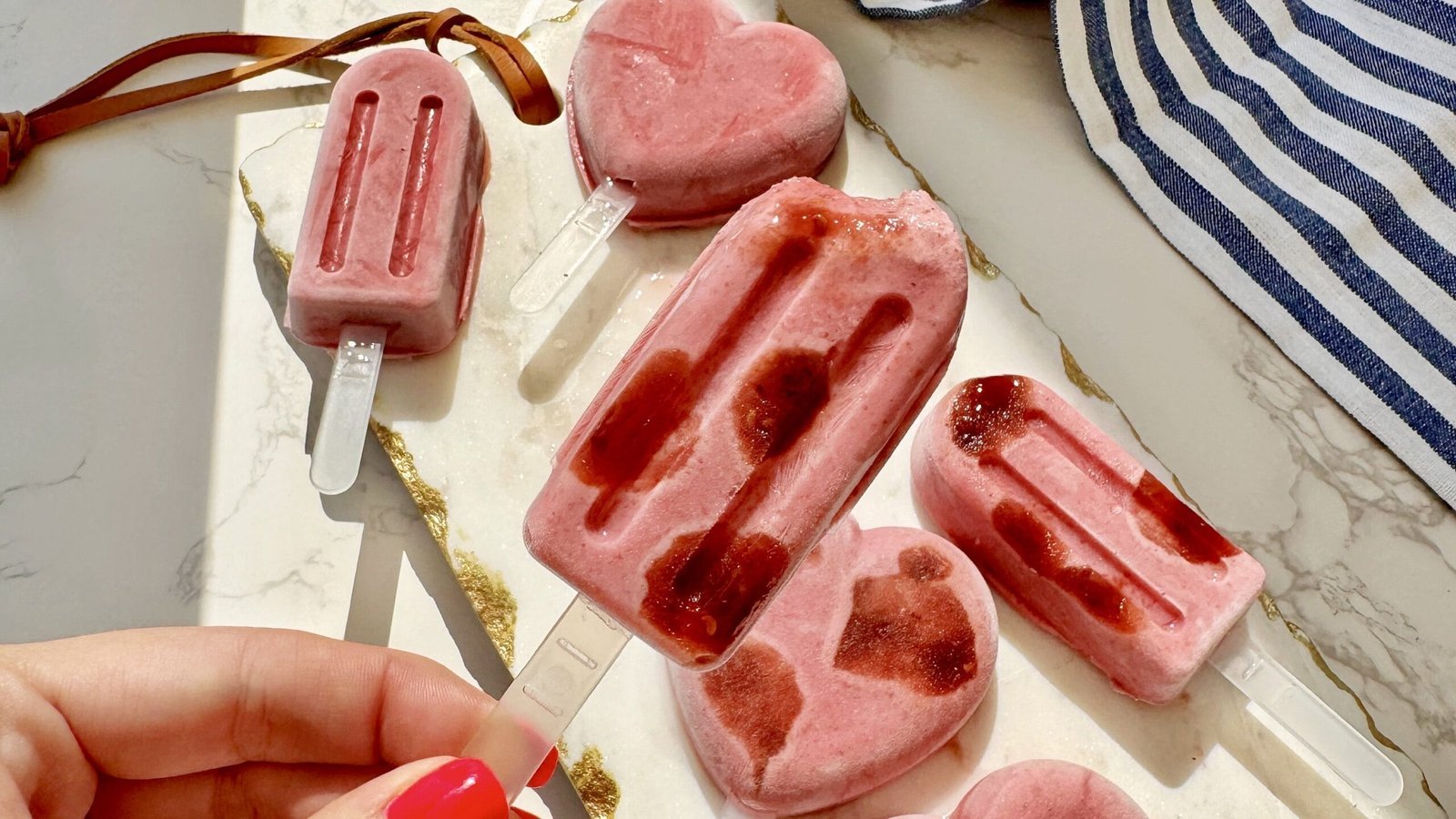 High protein raspberry yoghurt ice lollies, a chilled no-sugar-added frozen treat