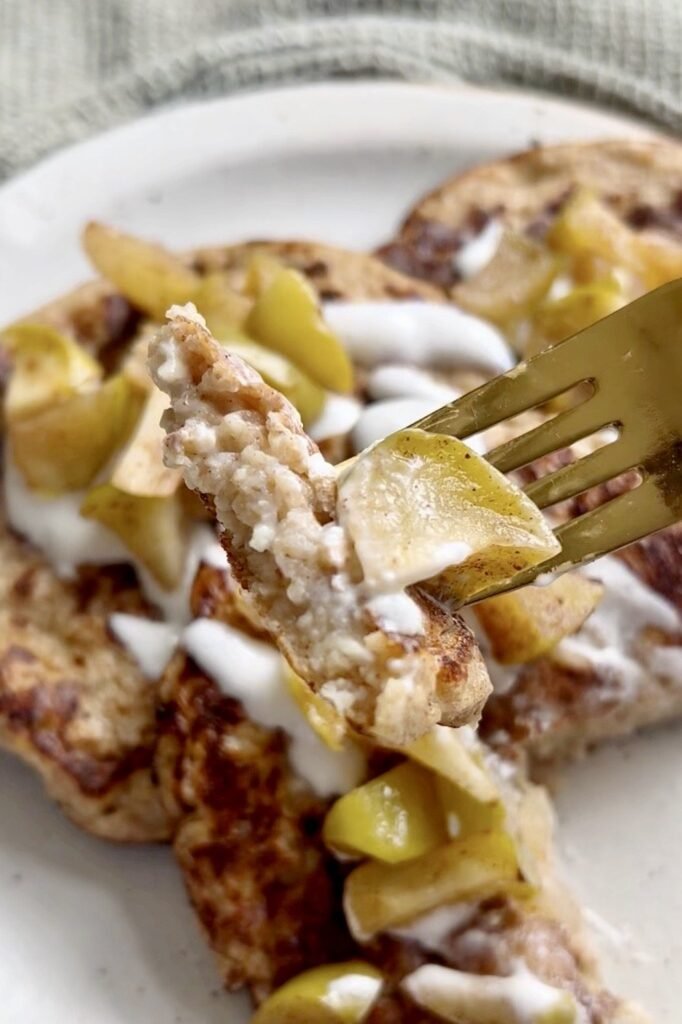 Forkful of fluffy cottage cheese pancake with spiced apple