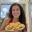 Alex Arciab, certified nutrition coach, smiling and holding a plate of egg muffins