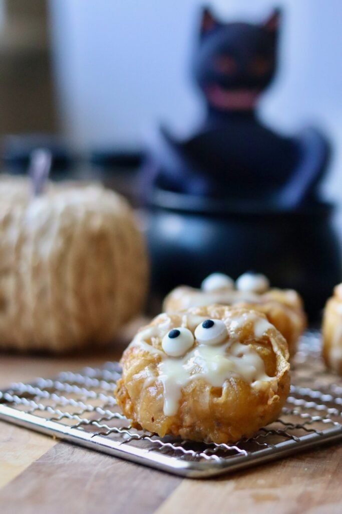 Close up of a rice paper pumpkin pie muffin decorated as a mummy