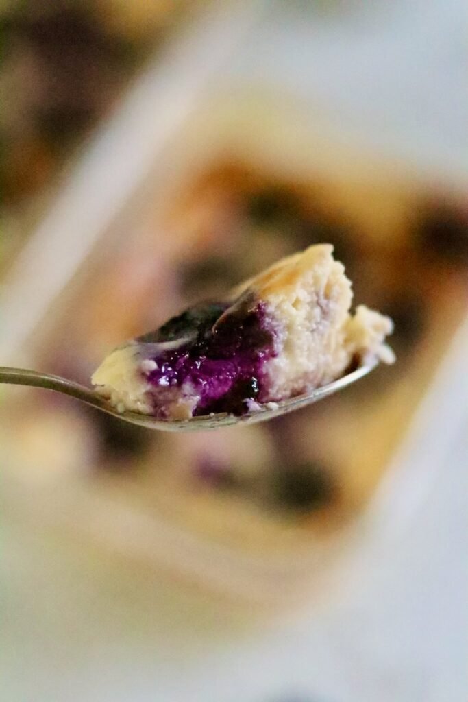 A spoonful of blueberry baked yogurt soufflé