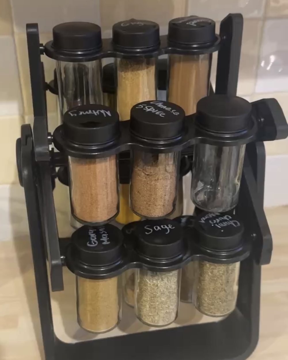 Rotating spice rack with labelled glass spice jars