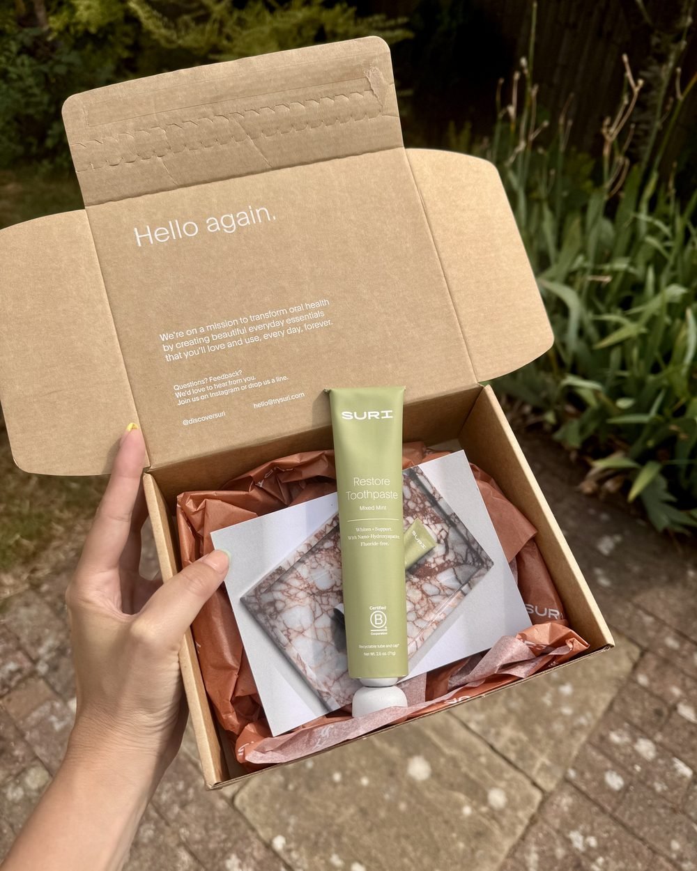 SURI Restore toothpaste in its delivery box